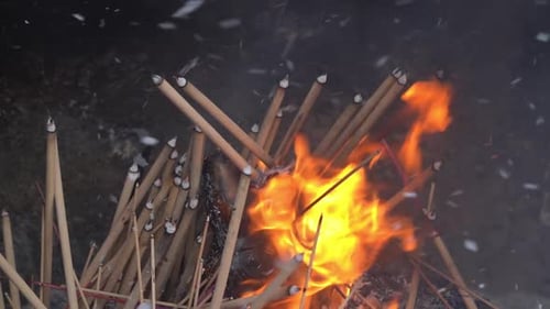 Incense Sticks Burning with Bright Flames and Smoke