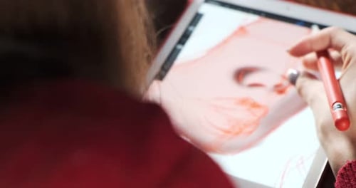 Close Up Female Designer Sitting and Working at Desk. Contemporary Young Woman Drawing and Using Pen