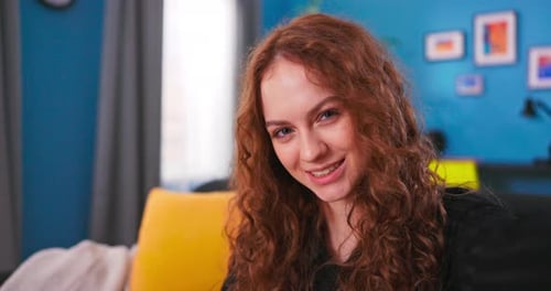 Smiling Woman Talking and Waving on Camera