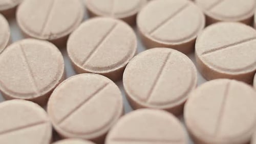 Beige Pills Arranged Close-Up for Medical Use