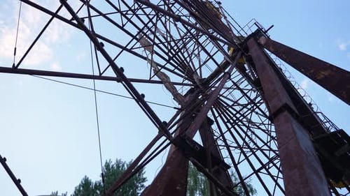 Decayed Ferris Wheel in Abandoned Amusement Park