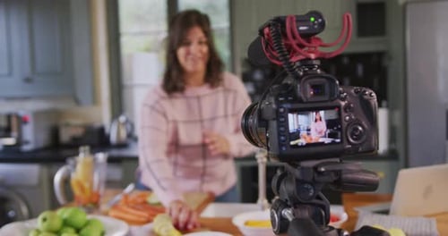 Woman Making Healthy Drink for Vlog in Kitchen
