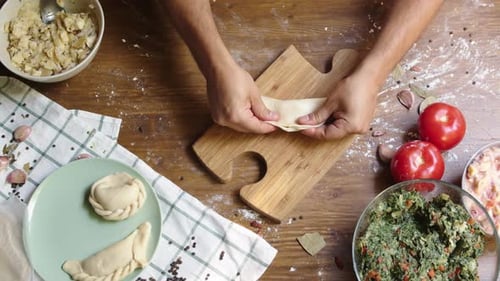 Man Cooking Empanada Argentinian Pie Traditional Bakery From Argentina Chef Filling Dough in Home