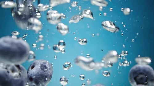 Blueberries Fall Into Water