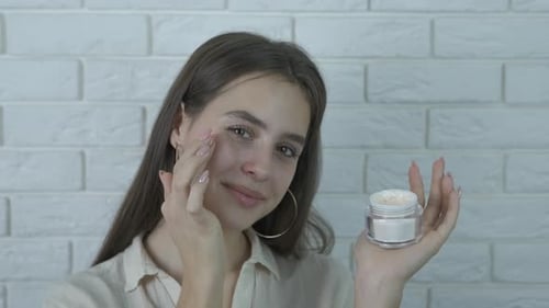 Moisture cream on face.