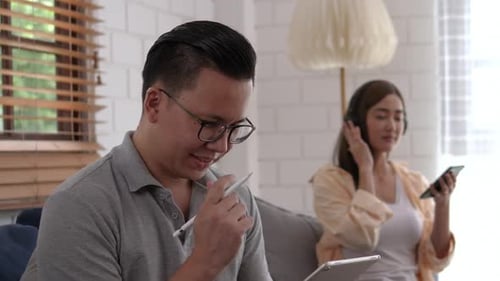 Couple Relaxing at Home with Technology