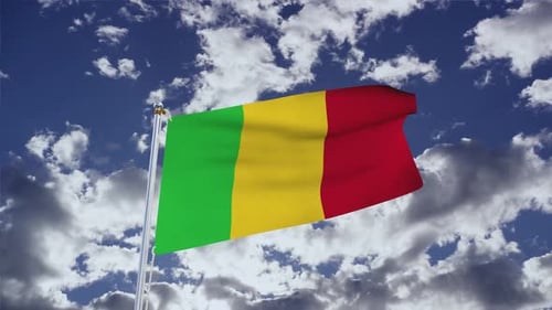 Waving Flag of Mali Against a Cloudy Blue Sky