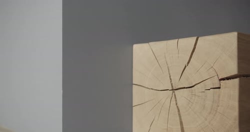 Square Piece of Wood in an Interiorin Minimalist Living Room with Gray Tone