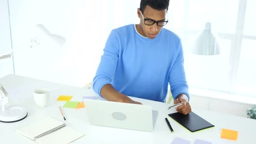 Online Banking by African Casual Man, Payment