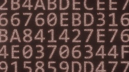 HACKING-Text bestehend aus vielen Symbolen auf dem Monitor