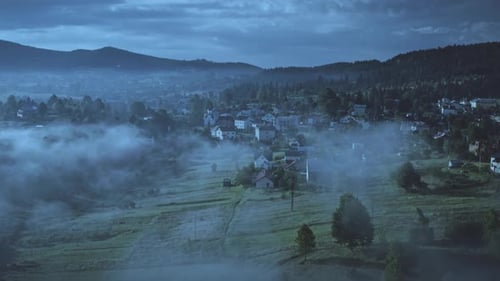 Night Mountain Village with Fog Aerial View