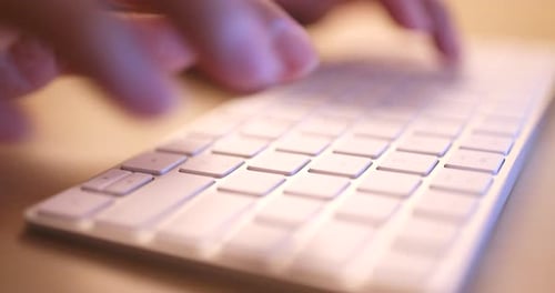 Typing on laptop computer