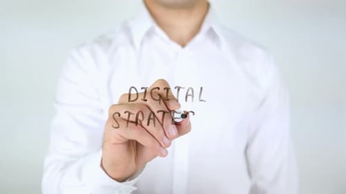 Writing Digital Strategy on Clear Surface