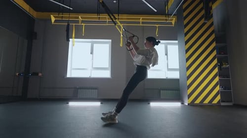 Fitness Woman Workout Exercise with Trx Equipment in the Fitness Gym Healthy Lifestyle Building