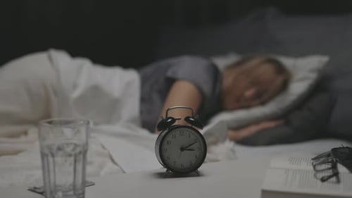Woman Sleeping Peacefully in Bed at Night