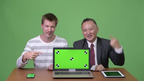 People Presenting Laptop with Chroma Key Screen