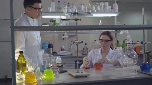Woman Scientist Conducting Experiment in Laboratory