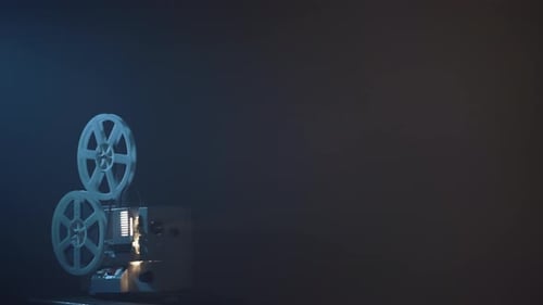 Vintage Film Projector Running in Dark Room