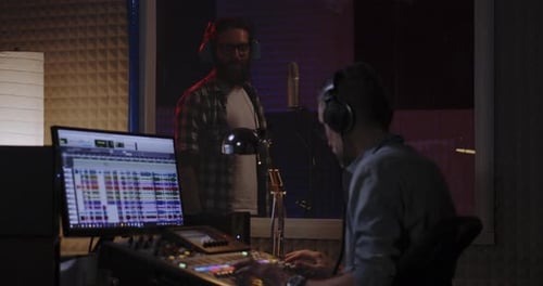 Man Recording His Own Voice Part in Studio