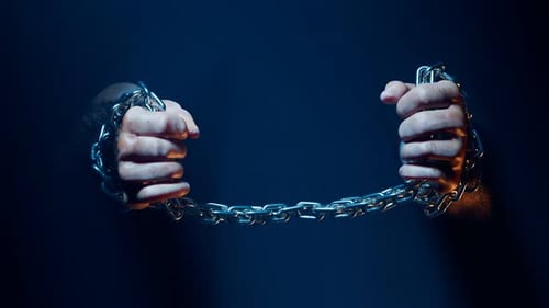 Hands breaking chains. Metal or steel chain is blown to pieces. Break free.