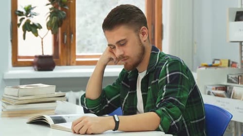 Tired Guy Falls Asleep While Studying