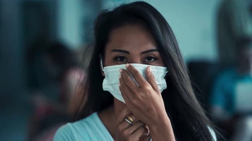 Young Asian Woman Wearing a Medicine Mask