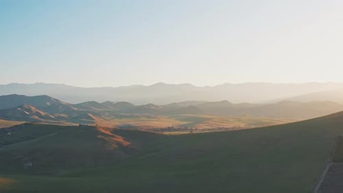 Rolling Hills Landscape at Sunrise Aerial View