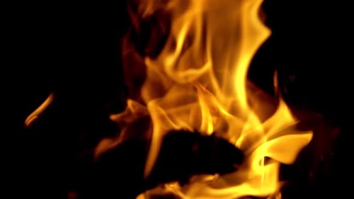 Close-Up Fire Flames Burning Against Dark Background