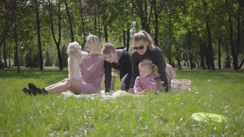 Happy Family Enjoying a Picnic in the Park