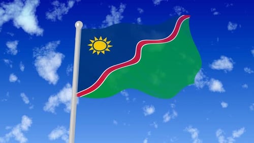 La bandera nacional de Namibia ondea en el cielo con nubes