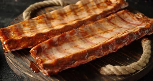 Raw Ribs on the Wooden Tray Slowly Rotate.