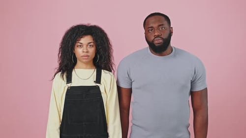 Young Adults Crossing Arms to Signal 'No'