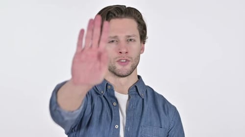 Young Adult Man Makes Stop Gesture to Camera