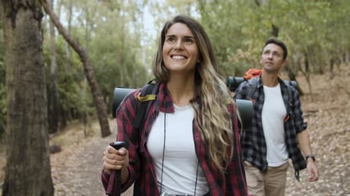 Couple Hiking Adventure in a Beautiful Forest