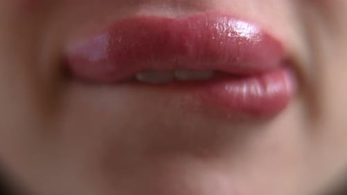 Woman's Lips Close-up With Pink Lipstick