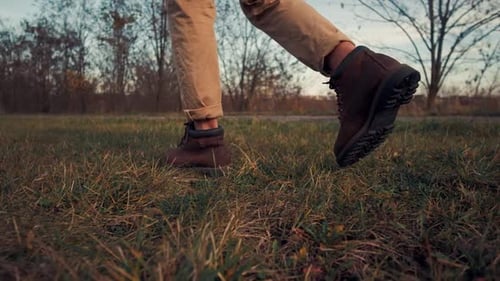 Close-up Low Angle Unrecognizable Man in Stylish Vintage Shoes Walks. Travel Concept