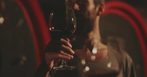 Man Cheers with Wine Glass Close-Up