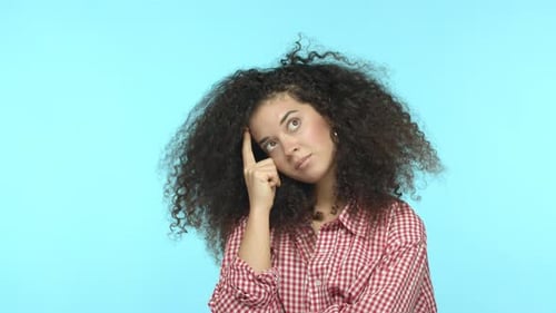 Slow Motion of Pensive Young Woman Trying to Thinkup Plan Shrugging and Having No Idea Standing Over