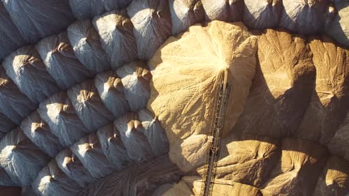 Conveyor in salt pits, extracts potash salts, pours sand into a heap. Transportation of an empty roc