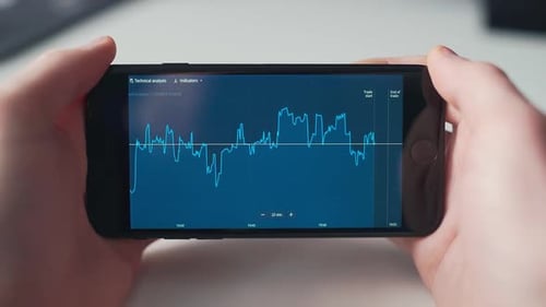 A Man Is Checking Stock Market on a Smartphone Screen