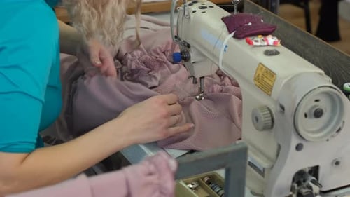 Seamstress Sewing Dress on a Sewing Machine