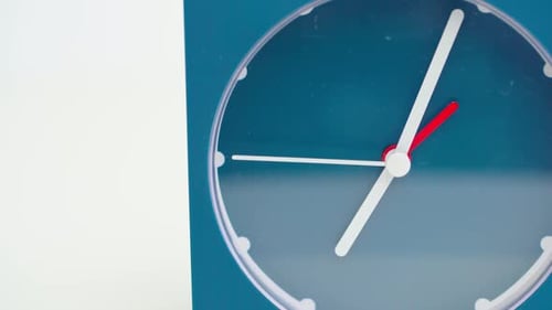 Blue Clock on White Background Close Up
