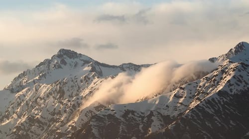 Aerial view of mountains and clouds at sunset