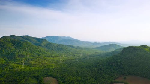 Lush Mountains and Transmission Towers from Above