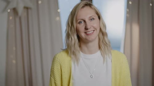 Smiling Woman with Blonde Hair Indoors
