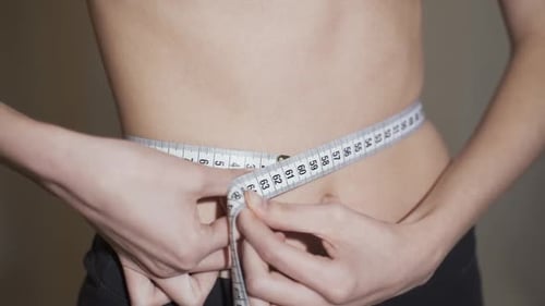 Fitness Woman Demonstrates Her Trained Belly