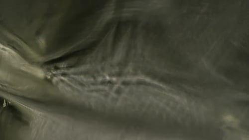 Abstract Shimmering Fluid Surface Close Up