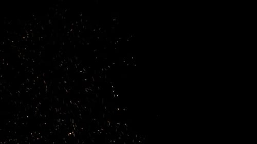 Golden Sparkling Particles on Black Background