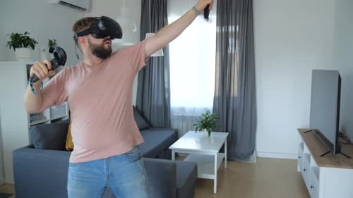 Man Experiencing Virtual Reality Game in Modern Home