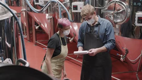 Brewery Workers At Beer Production Factory